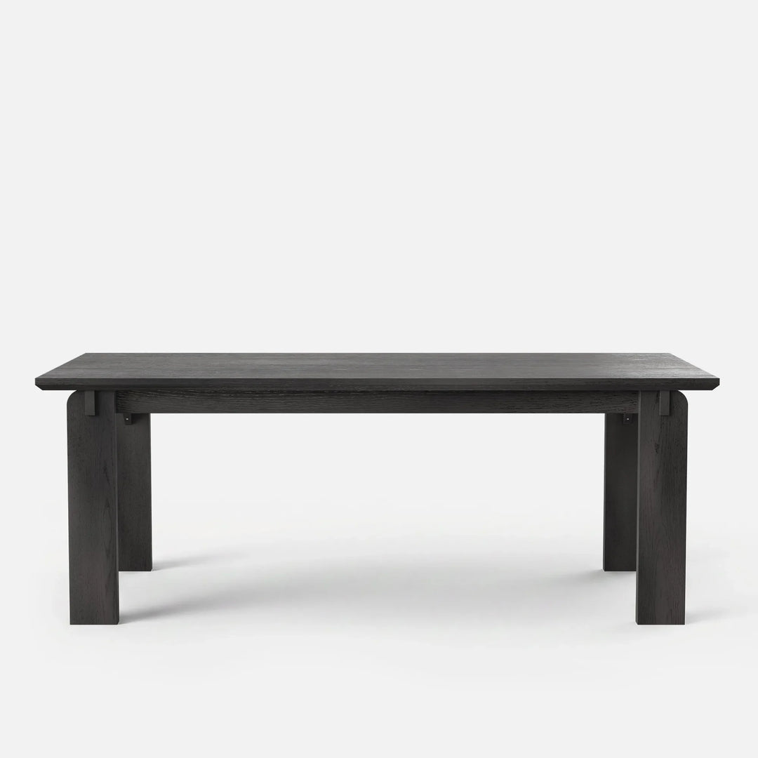 Dining table in solid pine and rubberwood with a red oak veneer and black walnut-tone finish