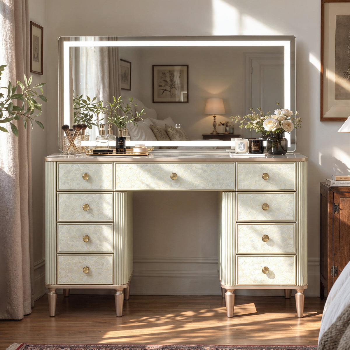 Makeup vanity table with a lighted mirror and mother-of-pearl drawers in a sunny bedroom
